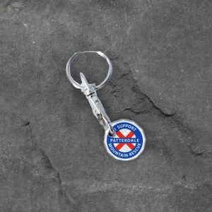 Patterdale Mountain Rescue trolley coin keyring on slate